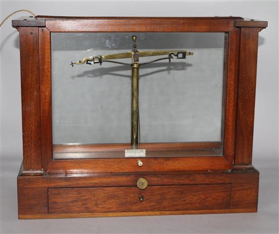 A set of mahogany cased chemists scales